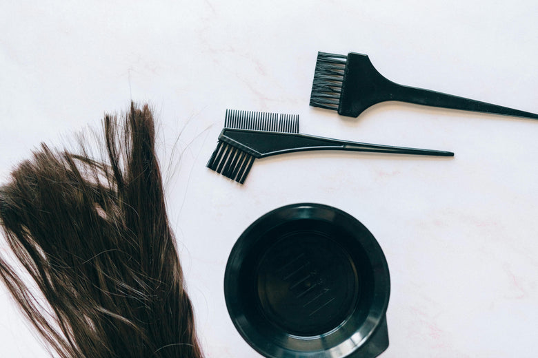 Can I dye my hair with extensions in?